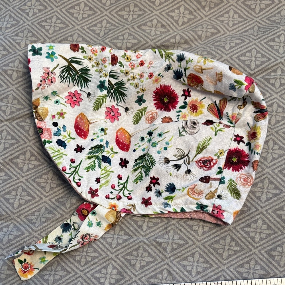 Urban baby bonnet reversible sun bonnet in mushroom forest garden.